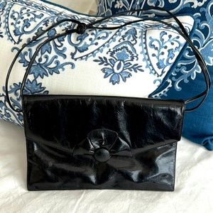 Black leather 11” by 8” magnetic closure clutch bag the front made in Italy